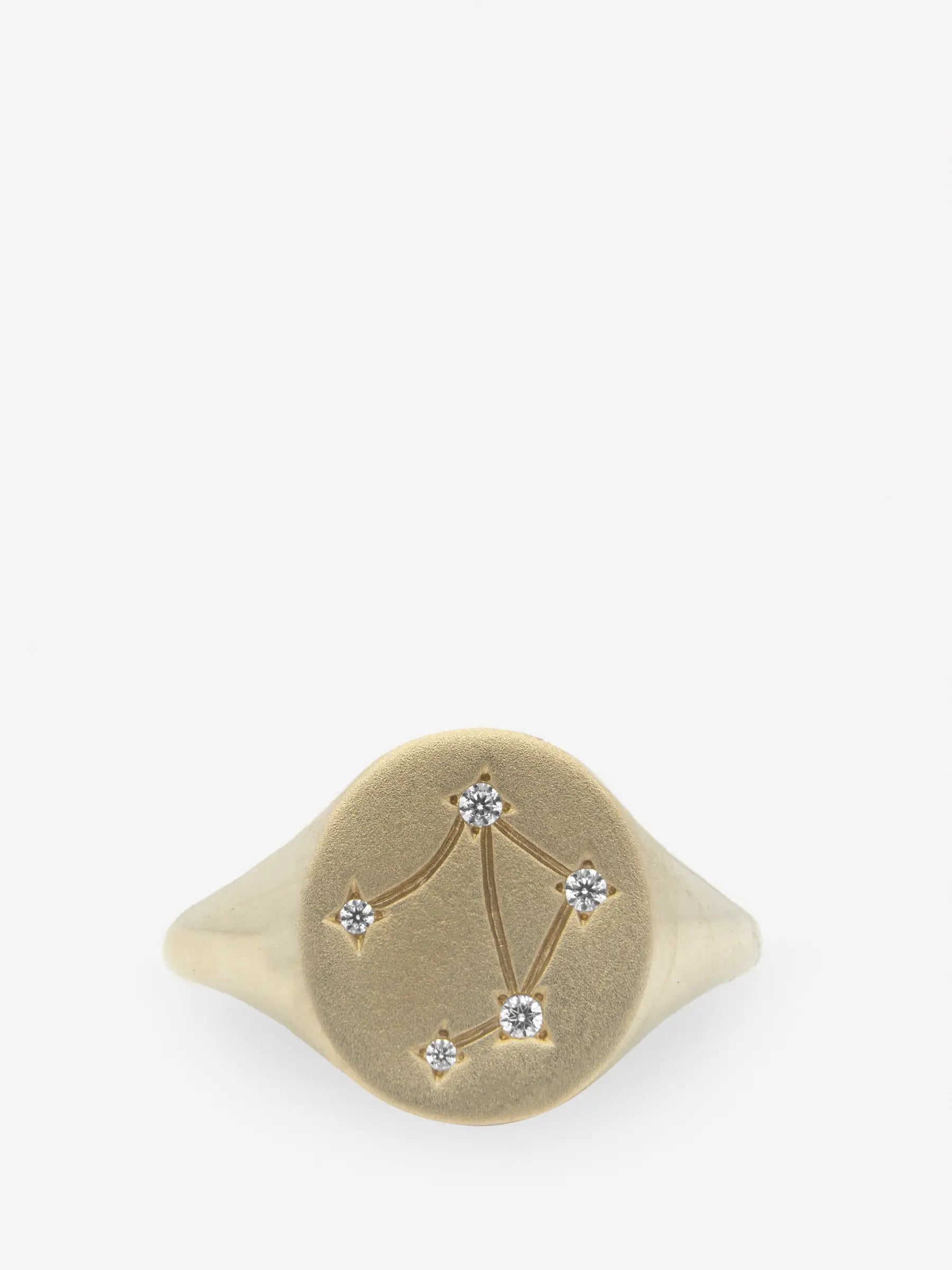 Anillo de plata esterlina con topacio blanco dibujando el signo zodiacal Libra.