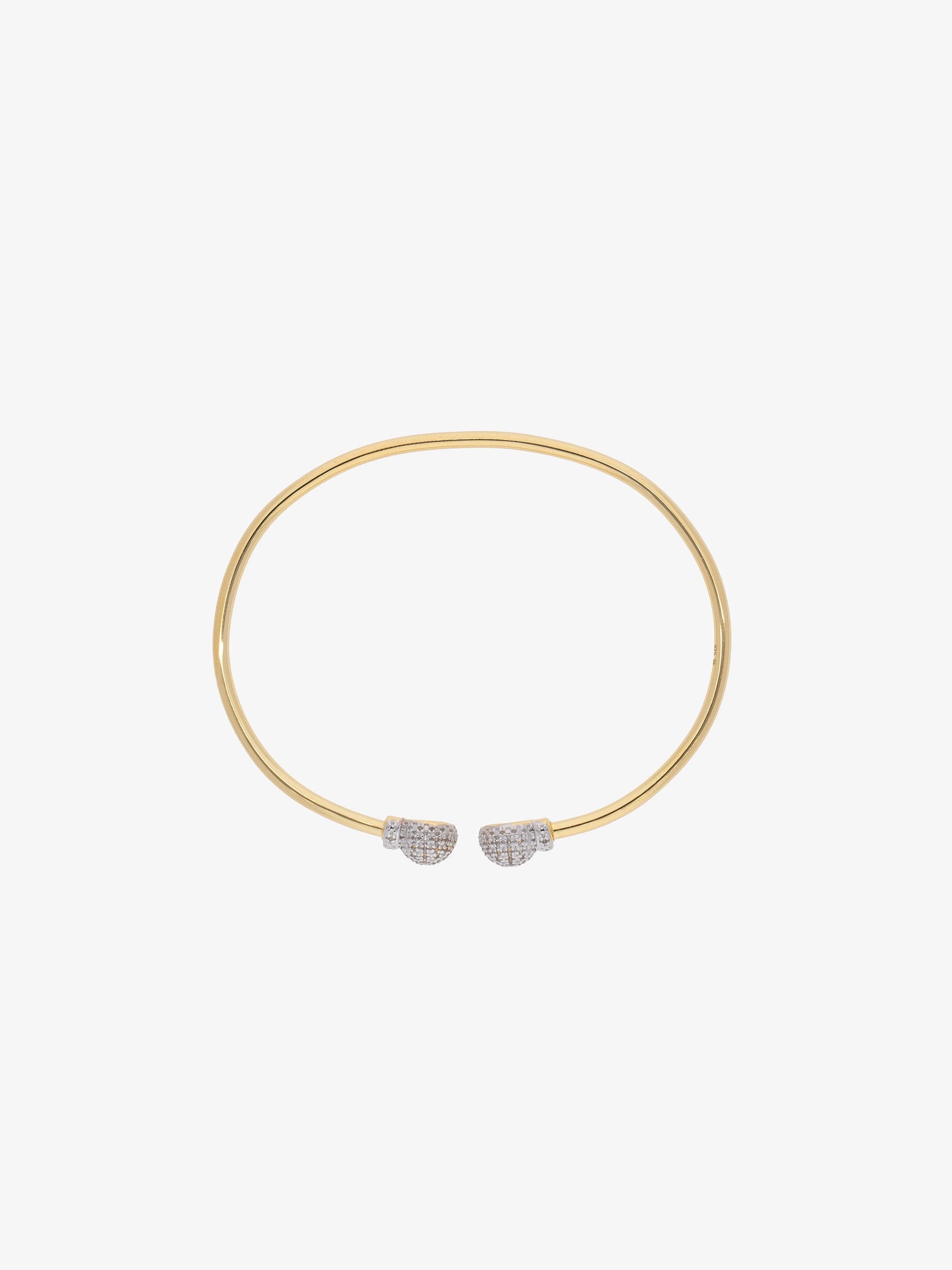 Brazalete abierto con extremos en forma de corazón cubiertos de topacios blancos.