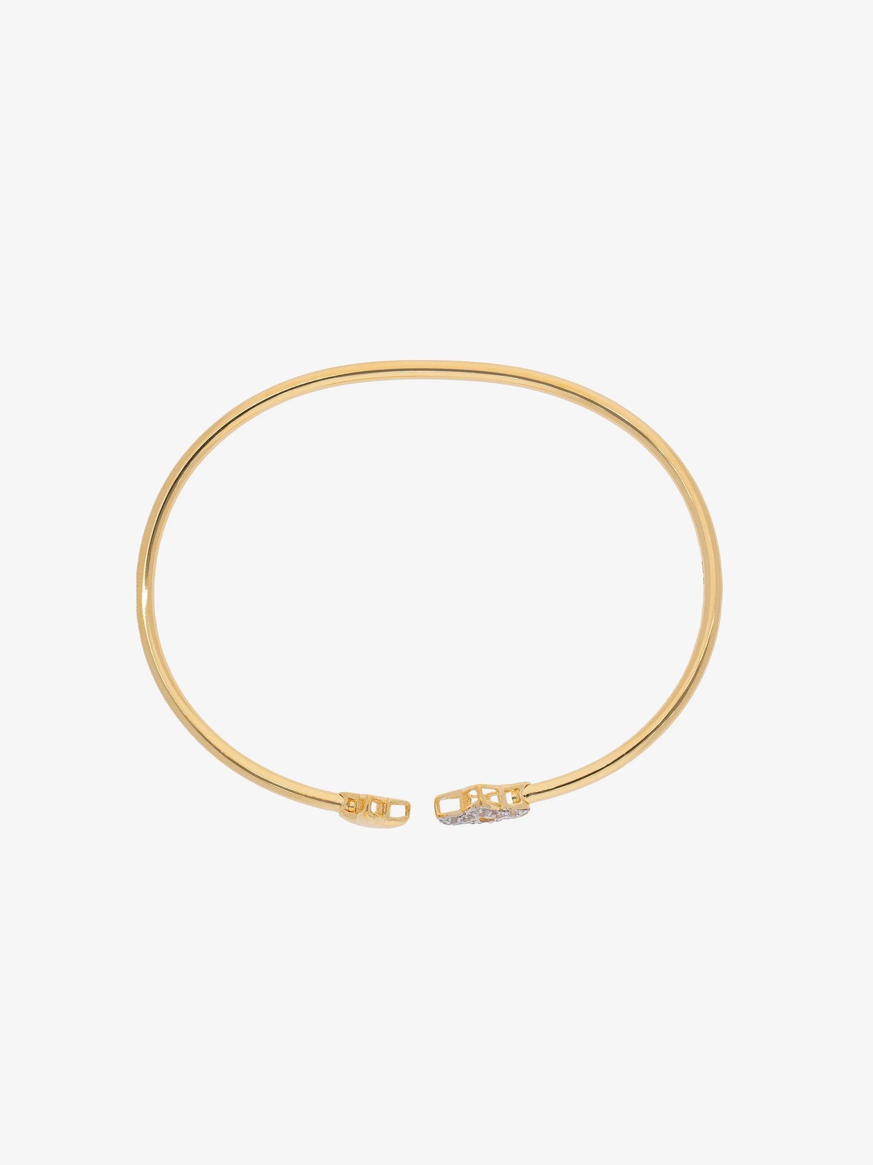 Brazalete abierto con extremos en forma de trébol cubiertos de topacios blancos.